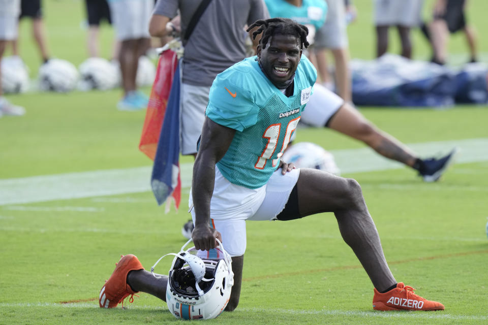 Miami Dolphins wide receiver Tyreek Hill stretches during a joint practice with the Atlanta Falcons at the NFL football team's training facility, Wednesday, Aug. 9, 2023, in Miami Gardens, Fla. (AP Photo/Wilfredo Lee)