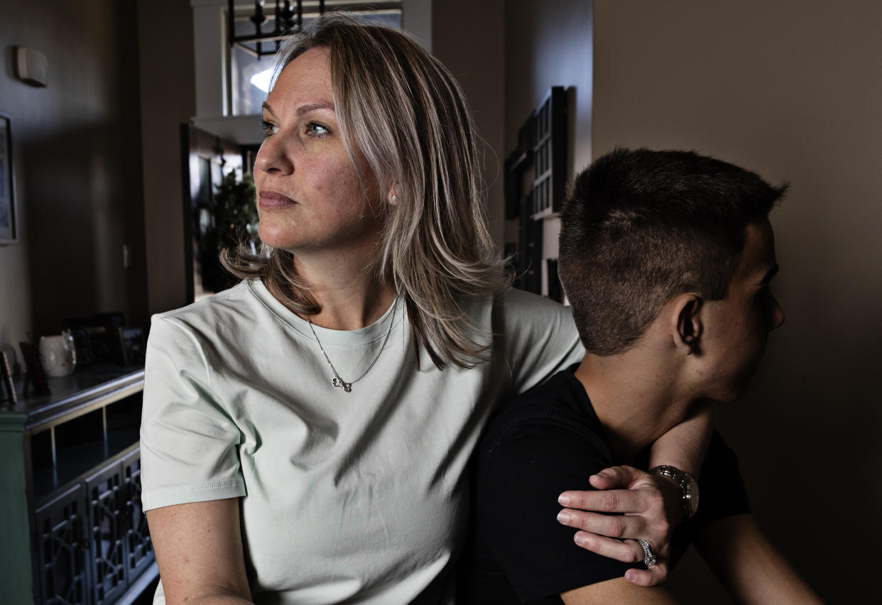 Heather McConney holds her son at their home in Layton, Utah (Kim Raff for NBC News)