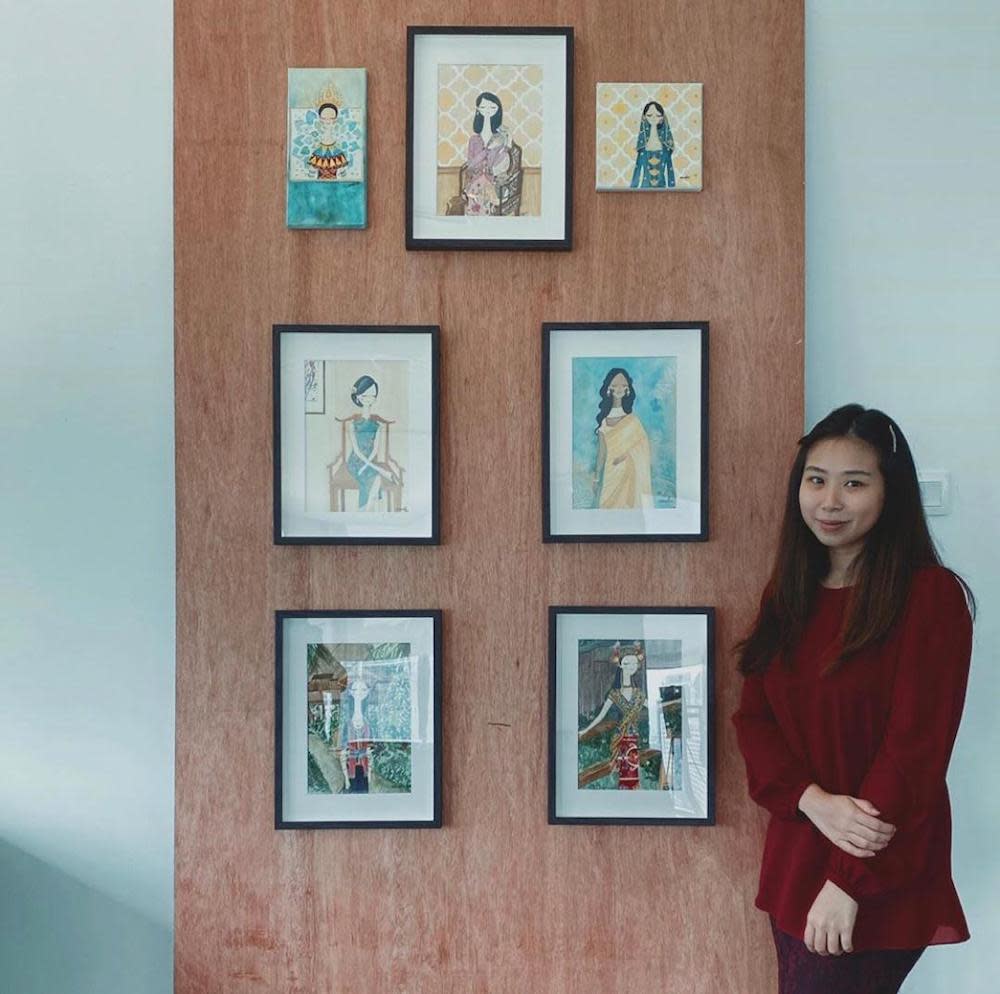 Noor Sarah and her portraits of her artwork featuring Malaysian women and their traditional attire. — Picture courtesy of Noor Sarah Reza.