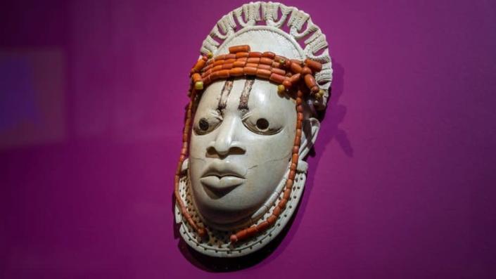 A 19th-century ivory, ceremonial hip mask in honour of Queen Mother Idia and looted by British soldiers from the Kingdom of Benin in 1897 hangs on display in the &quot;Where Is Africa&quot; exhibition at the Linden Museum on May 05, 2021 in Stuttgart, Germany