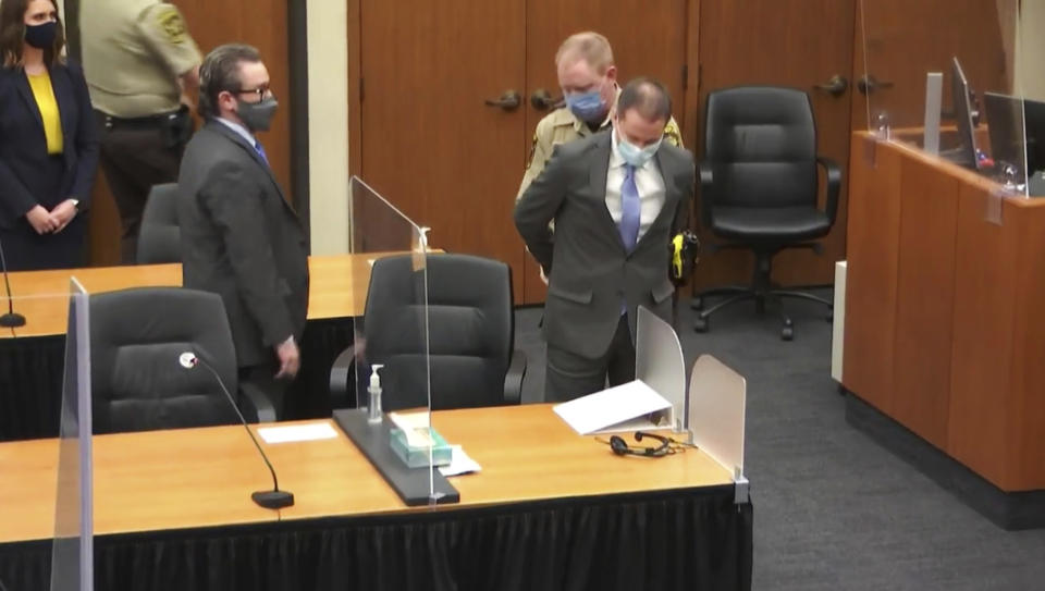 In this image from video, former Minneapolis police Officer Derek Chauvin is taken into custody as his attorney, Eric Nelson, left, looks on, after the verdicts were read at Chauvin's trial for the 2020 death of George Floyd, Tuesday, April 20, 2021, at the Hennepin County Courthouse in Minneapolis, Minn. (Court TV via AP, Pool)