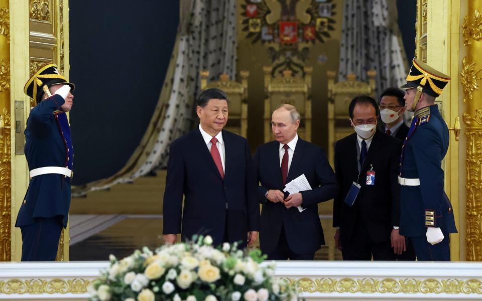 Putin and Xi enter a hall at The Grand Kremlin Palace - Sergei Karpukhin/Pool Sputnik Kremlin