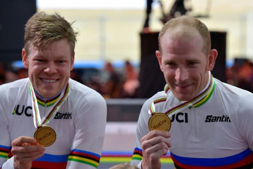 Denmark's Michael Morkov (R) and Lasse Norman Hansen celebrate winning the madison world title a day after Morkov was released from quarantine