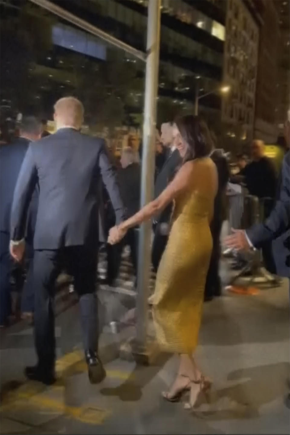 In this image from video, Prince Harry and his wife Meghan Markle exit Manhattan’s Ziegfeld Ballroom on Tuesday, May 16, 2023 in New York. The couple’s office says the pair and Meghan’s mother were followed by vehicles after leaving a charity event on Tuesday. It said in a statement Wednesday that the pursuit “resulted in multiple near collisions involving other drivers on the road, pedestrians and two NYPD officers.” The incident instantly drew comparisons to the 1997 fatal car crash of Harry’s mother, Princess Diana. (AP Photo)