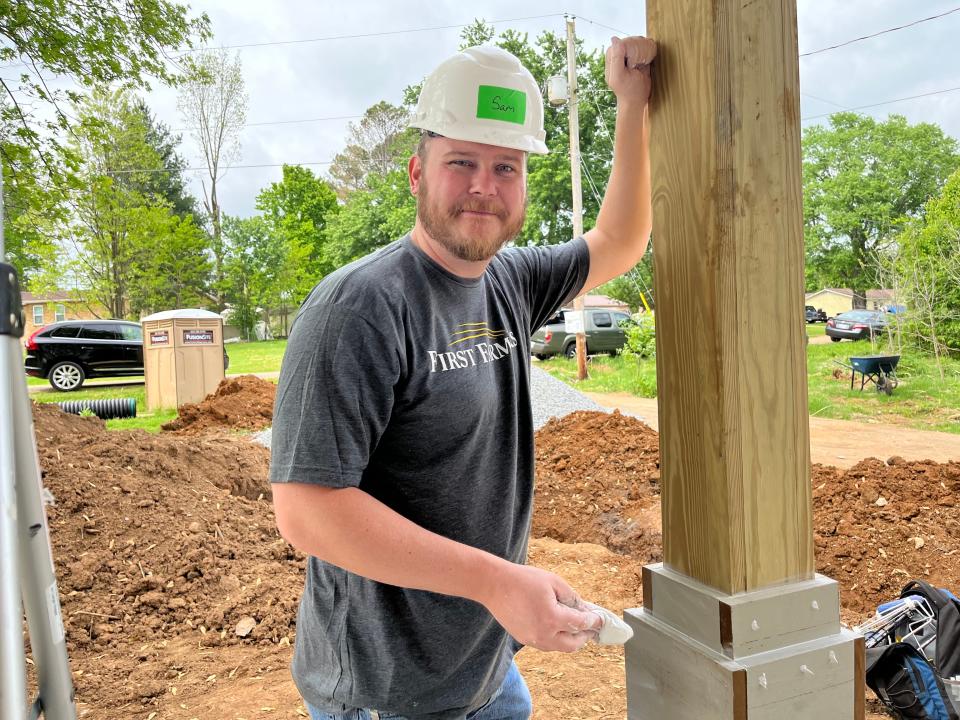 Sam Short, First Farmers trust officer, works on a home as a volunteer for Habitat for Humanity Williamson-Maury County.