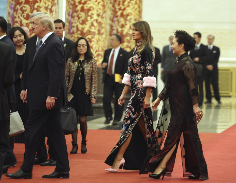 President Donald Trump, accompanied by first lady Melania Trump and Chinese first lady Peng Liyuan, arrives for a state dinner at the Great Hall of the People on Nov. 9, in Beijing. Trump is on a five-country trip through Asia traveling to Japan, South Korea, China, Vietnam, and the Philippines. (Photo: AP Photo/Andrew Harnik)