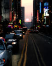 The setting sun sinks in perfect alignment with New York's 42nd Street July 11, 2005. Since Manhattan's east-west streets don't run precisely east-west, they align with the setting sun only twice a year, an event known locally as "Manhattanhenge". REUTERS/Jeff Zelevansky