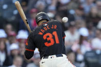 San Francisco Giants' LaMonte Wade Jr. is hit by a pitch during the seventh inning of the team's baseball game against the Cincinnati Reds, Saturday, May 11, 2024, in San Francisco. (AP Photo/Godofredo A. Vásquez)