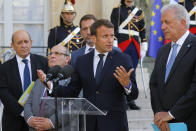 From left to right, French Foreign Minister Jean-Yves Le Drian, Director of the United Nations Migration Agency Antonio Manuel de Carvalho Ferreira Vitorino, French Interior Minister Christophe Castaner, French President Emmanuel Macron and European Commissioner for Migration and Home Affairs Dimitris Avramopoulos meet the media after a meeting at the Elysee Palace in Paris, France, Monday, July 22, 2019. European ministers have met in Paris seeking unity on how to deal with migrants crossing the Mediterranean Sea. (AP Photo/Michel Euler)