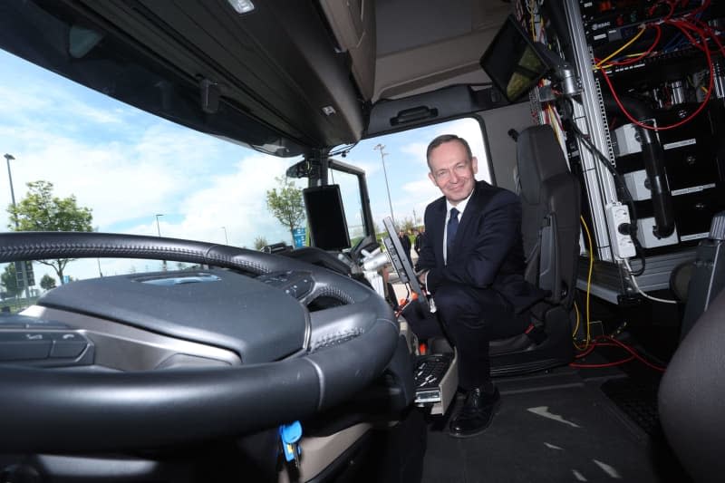 Volker Wissing German Minister of Transport, sits in the passenger seat of an autonomously driving MAN truck. On the A9 north of Munich, Wissing drove in a computer-controlled articulated lorry from Allershausen just under ten kilometers to the Fuerholzen-West service area. Karl-Josef Hildenbrand/dpa