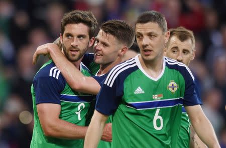 Football Soccer - Northern Ireland v Belarus - International Friendly - Windsor Park, Belfast, Northern Ireland - 27/5/16 Northern Ireland's William Grigg celebrates scoring their third goal with Oliver Norwood and teammates Reuters / Clodagh Kilcoyne