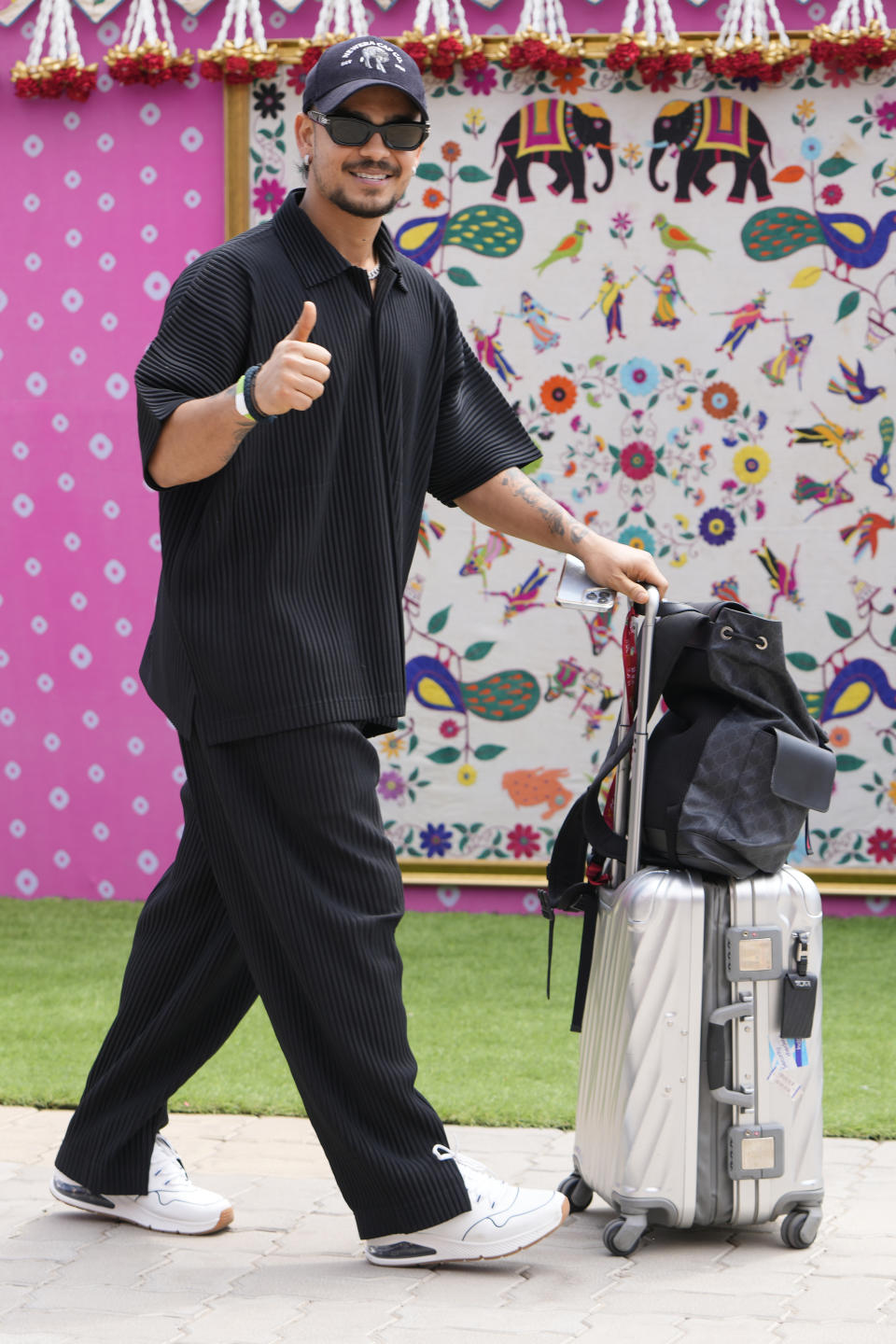 Indian cricketer Ishan Kishan arrives to attend a pre-wedding bash of billionaire industrialist Mukesh Ambani's son Anant Ambani, in Jamnagar, India, Friday, March 1, 2024. (AP Photo/Ajit Solanki)