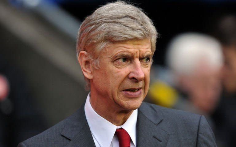 Arsenal's manager Arsene Wenger looks on before their English Premier League football match against Wigan Athletic at The DW Stadium in Wigan, north-west England on December 22, 2012. The jury is still out on Theo Walcott as a striker, but Wenger is not about to jump to conclusions on the strength of a couple of games