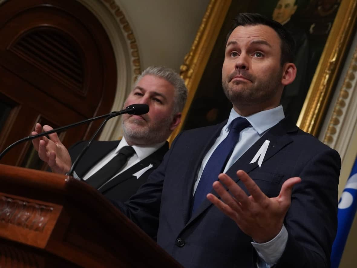 PQ Leader Paul St-Pierre Plamondon, right, and MNA Pascal Bérubé, left, meet with reporters on the opening day of the National Assembly, after the 2022 fall election. (Sylvain Roy Roussel/CBC - image credit)