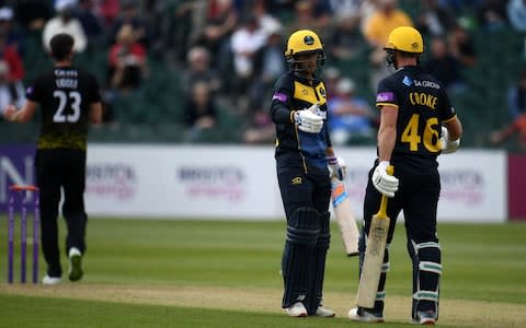 Chris Cooke of Glamorgan(R) embraces Billy Root of Glamorgan after reaching their 200 paetnership during the Royal London One Day Cup match between Gloucestershire and Glamorgan - Credit: GETTY IMAGES