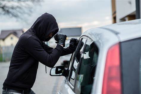 <img src="steal-car.jpeg" alt="Car thief breaking into a car">