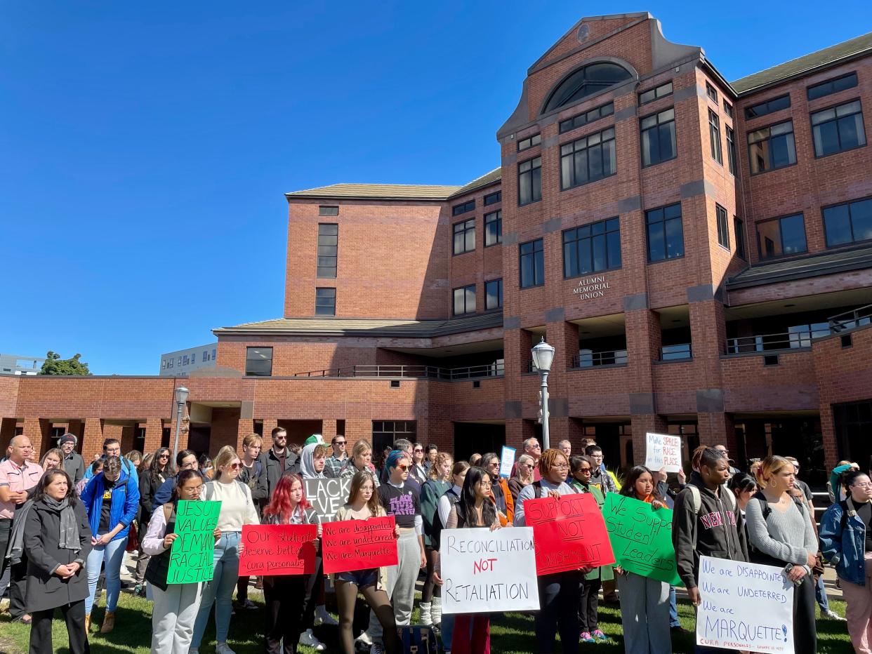 Marquette University students and staff stand in solidarity Wednesday with 10 students who protested during Convocation and have been subsequently punished.