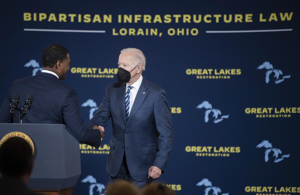 President Joe Biden shakes hands with Environmental Protection Agency Administrator Michael Regan during an event at the Shipyards, Thursday, Feb. 17, 2022, in Lorain, Ohio. (AP Photo/Ken Blaze)