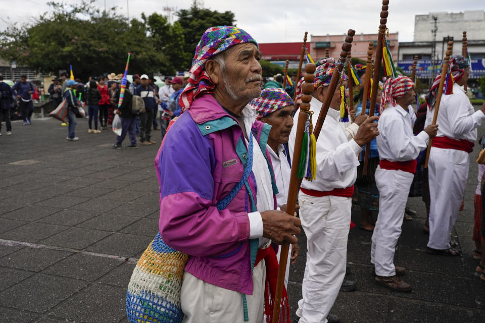 Indigenous people accompany President-elect Bernardo Arévalo in a march in protest of government interference in the elections he won in August, in Guatemala City, Thursday, Dec. 7, 2023. Arévalo is set to take office on Jan. 14, 2024. (AP Photo/Moises Castillo)