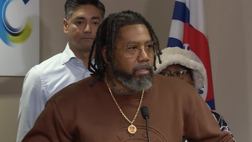 Isaac Davis, whose son was killed Friday in a shooting in Cincinnati, speaks Sunday at a news conference alongside city officials. - WLWT