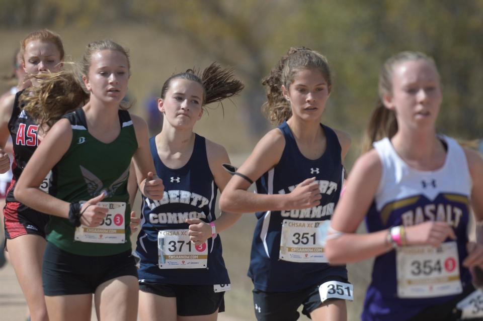 Liberty Common runners Amelia Harkey (371) and Ali Gomez (351) during the state meet at Norris Penrose Event Center on Saturday, Oct. 17, 2020.