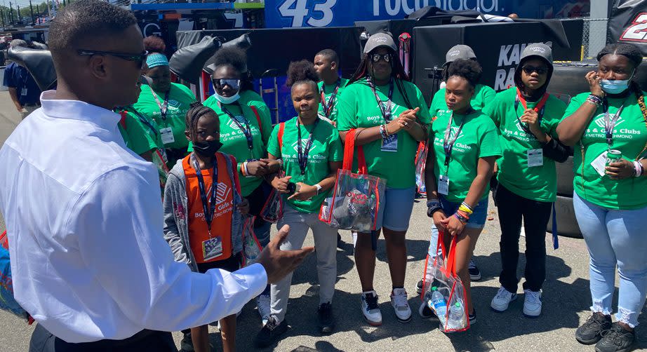 Boys and Girls Clubs members get a talk from a NASCAR industry member at Richmond