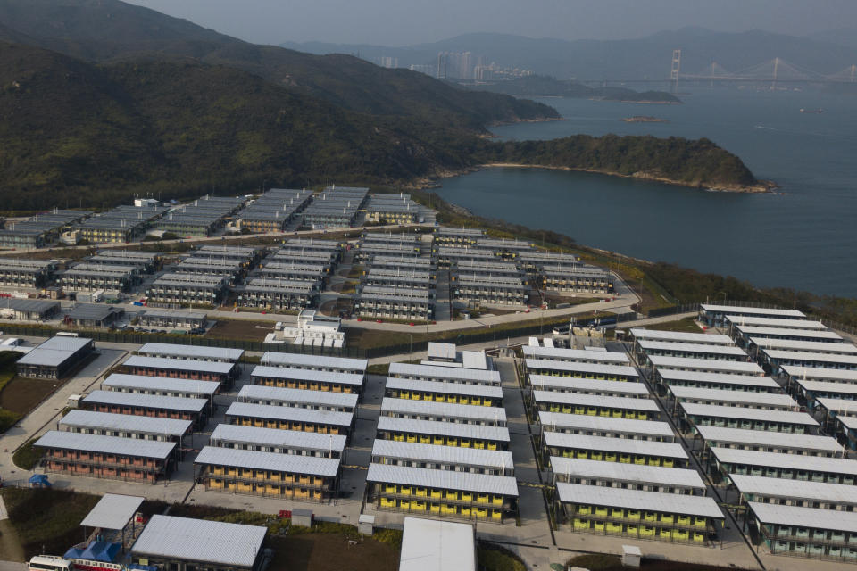 FILE - An aerial view shows the isolation units at the Penny's Bay Quarantine Centre on Lantau Island, in Hong Kong on Feb. 24, 2022. The fast-spreading omicron variant is overwhelming Hong Kong, prompting mass testing, quarantines, supermarket panic-buying and a shortage of hospital beds. Even the morgues are overflowing, forcing authorities to store bodies in refrigerated shipping containers. (AP Photo/Kin Cheung, File)