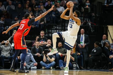 Nov 14, 2018; Minneapolis, MN, USA; Minnesota Timberwolves center Karl-Anthony Towns (32) shoots over New Orleans Pelicans forward Anthony Davis (23) during the first quarter at Target Center. Brace Hemmelgarn-USA TODAY Sports