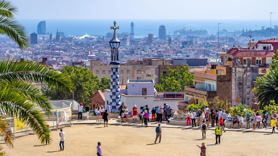 People take in the panoramic views of Barcelona from Park Güell. The precise moment of equinox in the popular city in Spain will be 8:50 a.m. Saturday. - Roman Belogorodov/Alamy Stock Photo