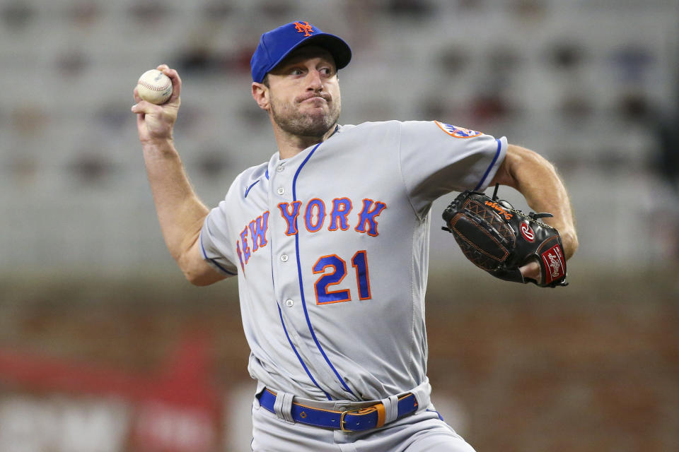 New York Mets starting pitcher Max Scherzer throws during the first inning of the team's baseball game against the Atlanta Braves, Saturday, Oct. 1, 2022, in Atlanta. (AP Photo/Brett Davis)