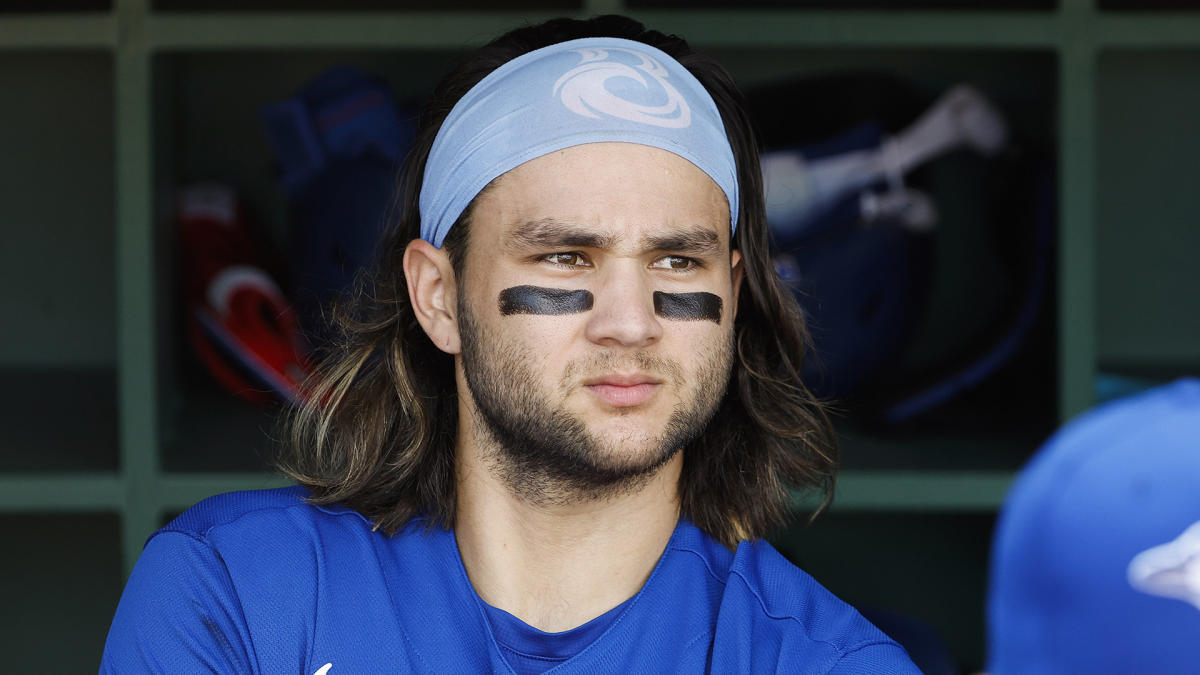 Bo Bichette of the Toronto Blue Jays flicks his hair back after