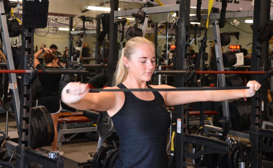 Florida Tech women's swimmer Erin Graham, a senior psychology major, works out Wednesday in the Anthony J. Catanese Varsity Training Center on campus.