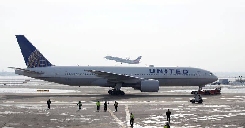 FILE PHOTO: A United Airlines Boeing 777 plane is towed at O'Hare International Airport in Chicago