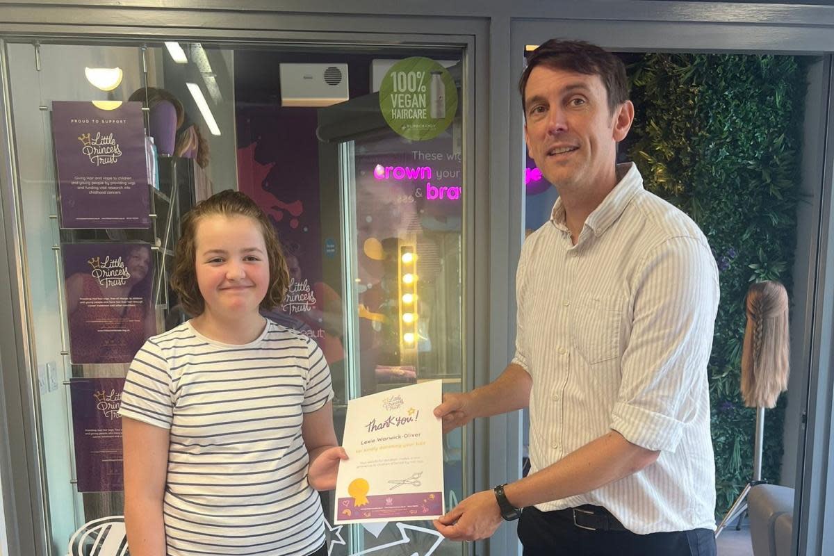 Lexie Warwick-Oliver with Ian Morris, the communications manager during a visit to the Little Princess Trust. <i>(Image: Jess Warwick-Oliver/PA Wire)</i>