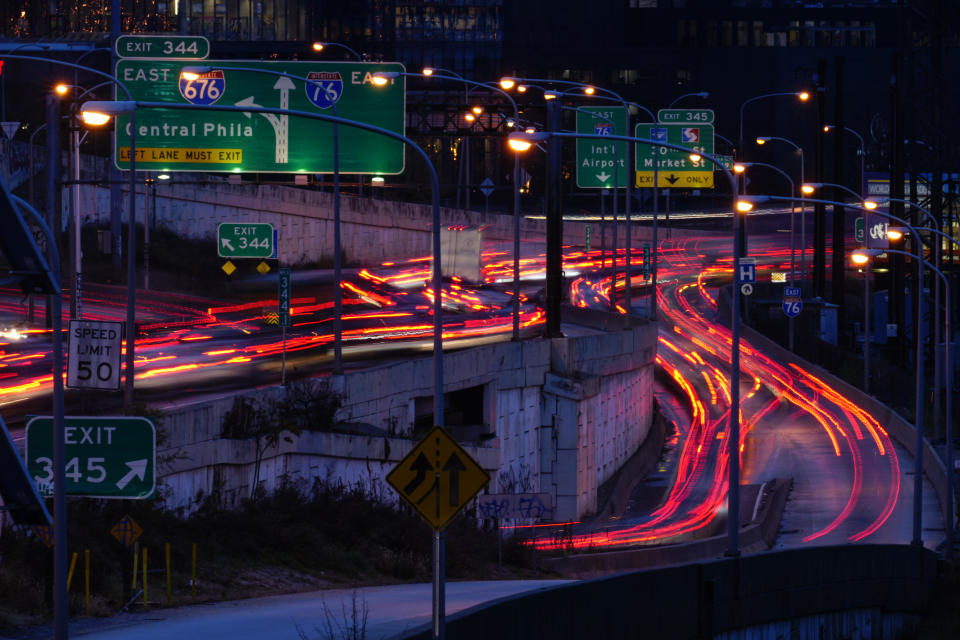 In this image made with a long exposure, motor vehicles move along Interstate 76 ahead of the Thanksgiving Day holiday in Philadelphia, Wednesday, Nov. 22, 2023. (AP Photo/Matt Rourke)