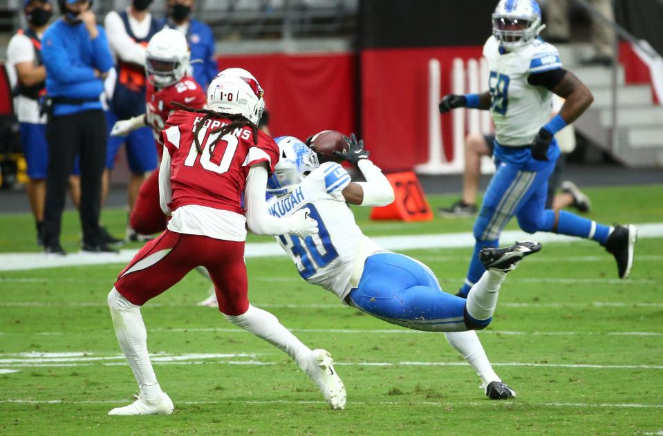 Sep 27, 2020; Glendale, Arizona, USA; Arizona Cardinals quarterback Kyler Murray throws an interception to Detroit Lions cornerback Jeff Okudah (30) in the second half at State Farm Stadium. Mandatory Credit: Rob Schumacher/The Arizona Republic via USA TODAY NETWORK