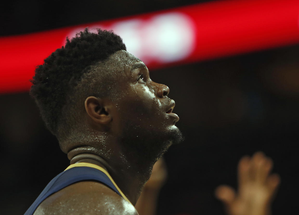 SAN ANTONIO,TX - OCTOBER 13:  Zion Williamson #1  of the New Orleans Pelicans watches a foul shot taken against the San Antonio Spurs in a pre-season game  at AT&amp;T Center on October 13 , 2019 in San Antonio, Texas.  NOTE TO USER: User expressly acknowledges and agrees that , by downloading and or using this photograph, User is consenting to the terms and conditions of the Getty Images License Agreement. (Photo by Ronald Cortes/Getty Images)