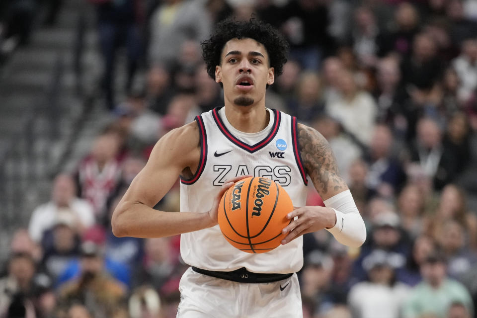 Gonzaga guard Julian Strawther handles the ball in the first half of an Elite 8 college basketball game against UConn in the West Region final of the NCAA Tournament, Saturday, March 25, 2023, in Las Vegas. (AP Photo/John Locher)