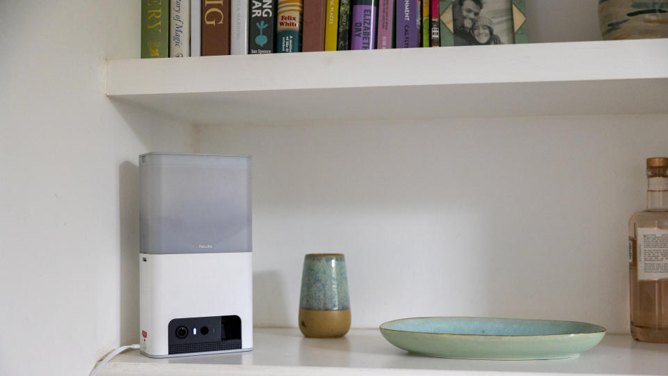 The Petcube Bites 2 Lite on a bookshelf