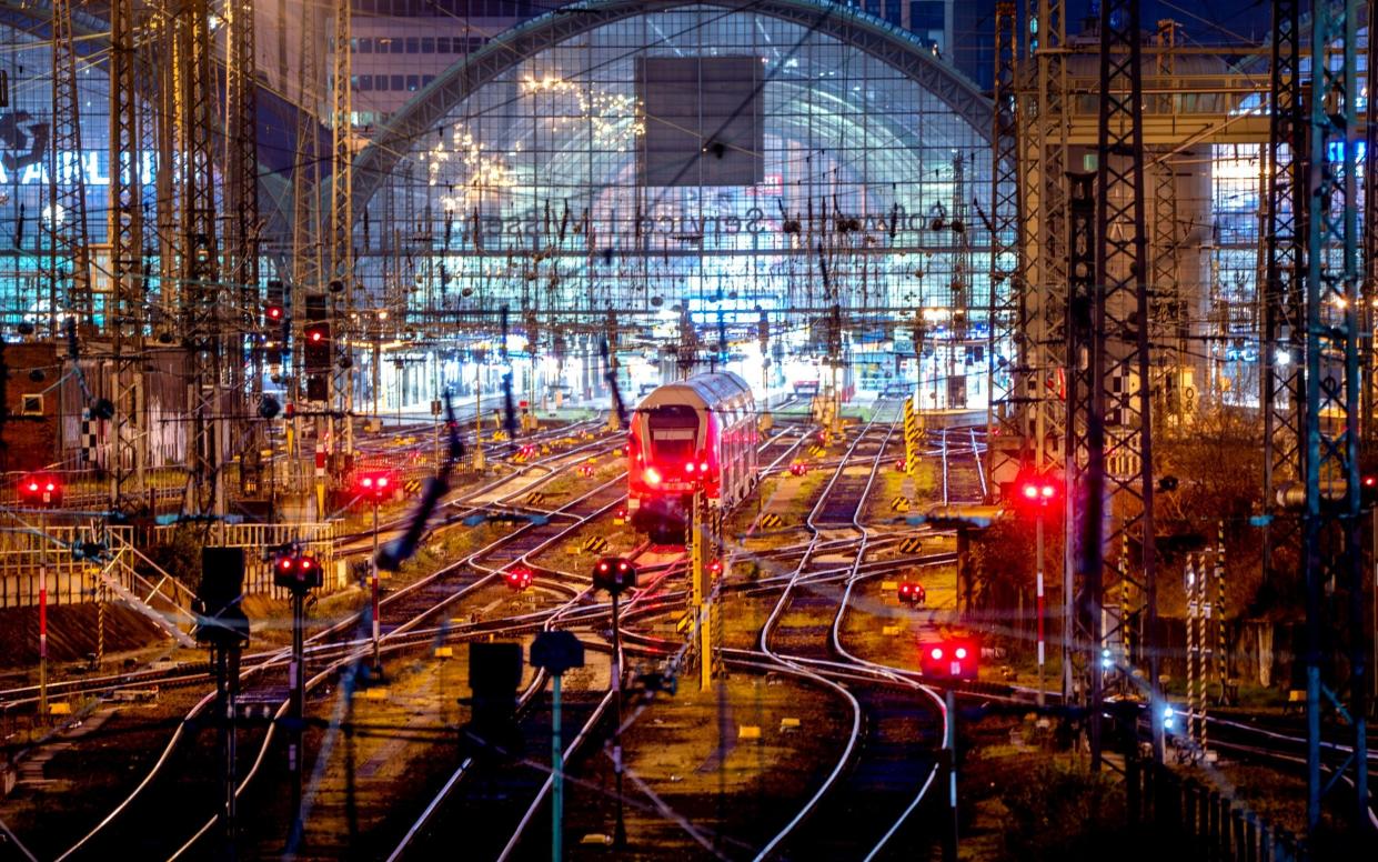 A train is parked outside the central train station in Frankfurt amid mass walkouts - AP