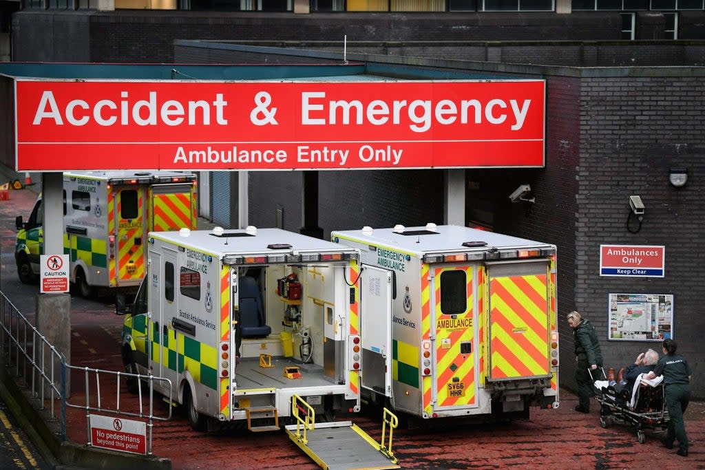 Emergency services are under ‘acute pressure’ amid a surge in Covid-19 cases (picture shows ambulances at Glasgow Royal Hospital)  (Getty)