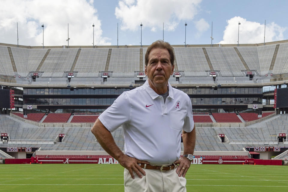 FILE - In this Aug. 3, 2019, file photo, Alabama head coach Nick Saban prepares for a team coach photo prior to Alabama's fall camp fan-day NCAA college football scrimmage at Bryant-Denny Stadium in Tuscaloosa, Ala. This is the time of year when the Southeastern Conference usually validates its claim as the best league in college football by dominating neutral-site nonconference matchups. The SEC is 21-6 in regular-season nonconference games against Power Five opponents at neutral sites since 2012. (AP Photo/Vasha Hunt, File)