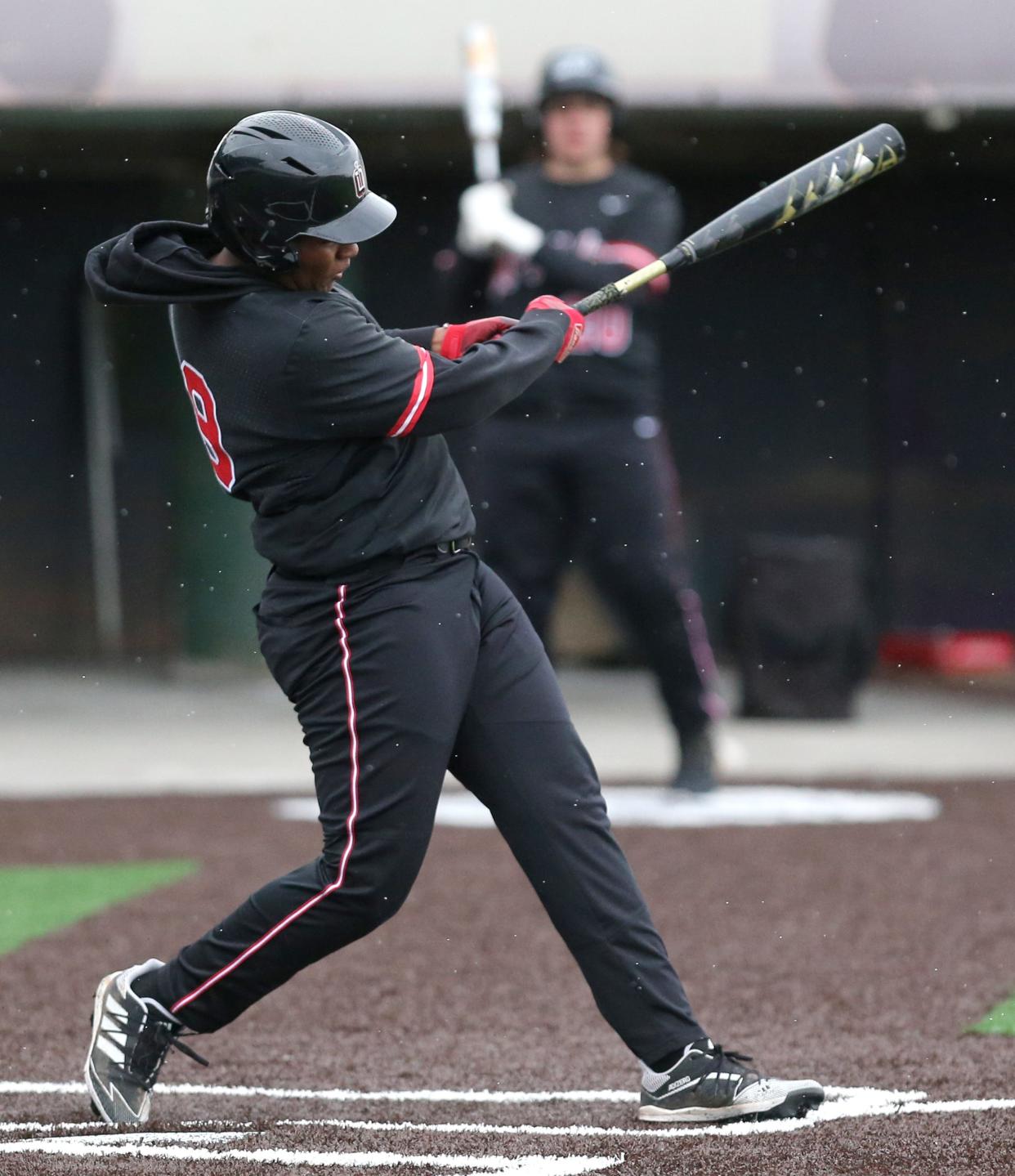 Savian Wilkins of McKinley drives in a run during their game against Canton South at McKinley on Friday, April 1, 2022.