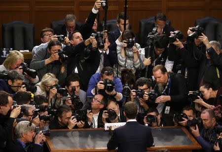 Facebook CEO Mark Zuckerberg is surrounded by members of the media as he arrives to testify before a Senate Judiciary and Commerce Committees joint hearing regarding the company’s use and protection of user data, on Capitol Hill in Washington, U.S., April 10, 2018. REUTERS/Leah Millis