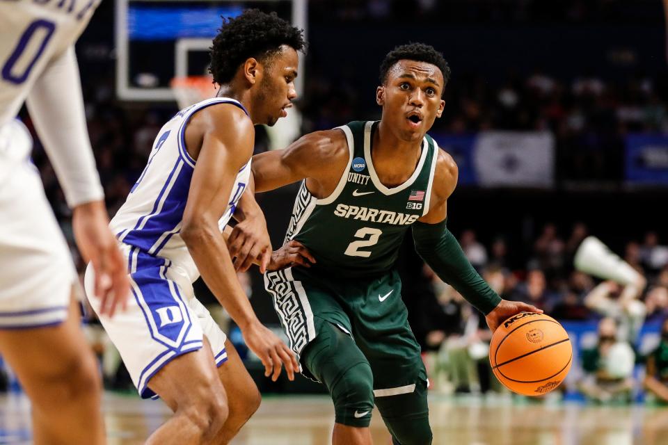 Michigan State guard Tyson Walker (2) looks to pass against Duke guard Jeremy Roach (3) during the first half of the second round of the NCAA tournament at the Bon Secours Wellness Arena in Greenville, S.C..