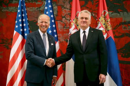 U.S. Vice President Joe Biden (L) and Serbia's President Tomislav Nikolic pose for media before their meeting in Belgrade, Serbia, August 16, 2016. REUTERS/Djordje Kojadinovic