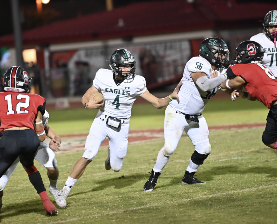 Grape Creek High School's Dalton Dillon (4) looks for a hole in the Sonora defense as Dante Huerta (56) provides blocking in a District 2-3A Division II football game Friday, Oct. 29, 2021, at Bronco Stadium in Sonora.