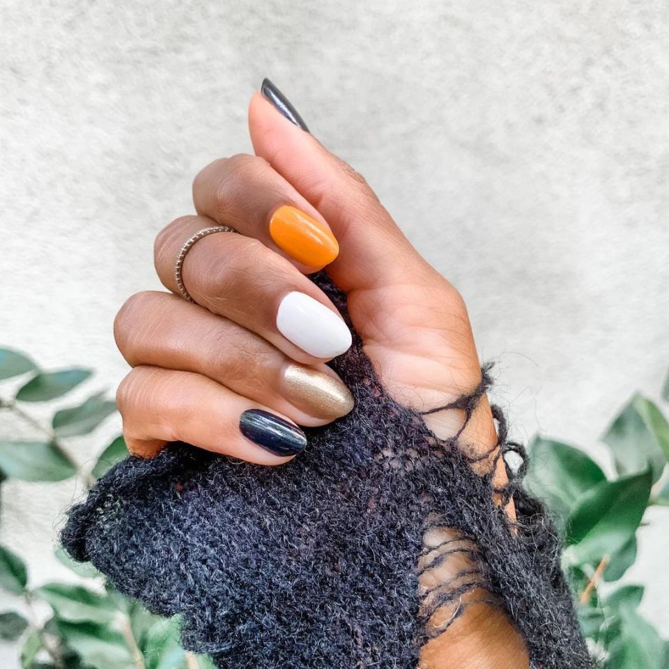 For a nonliteral take on candy corn, paint different nails in shades or orange, yellow, and white. Pops of gold and black keep things interesting.