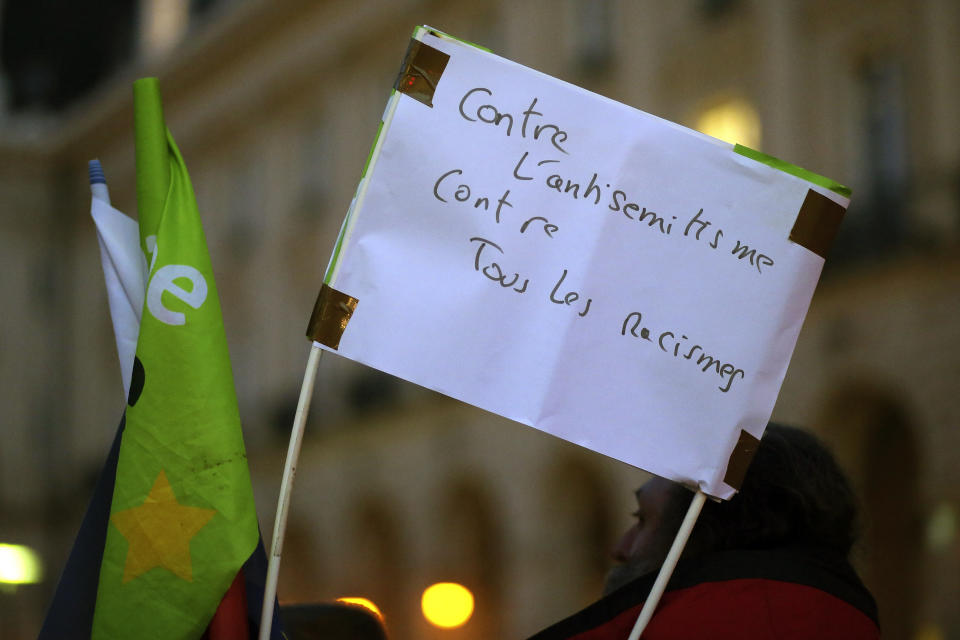 Protesters against anti-Semitism gather in Rennes, western France, Tuesday, Feb. 19, 2019, after a series of anti-Semitic acts that shocked the country. French residents and public officials from across the political spectrum geared up Tuesday for nationwide rallies against anti-Semitism following a series of anti-Semitic acts, including the swastikas painted on about 80 gravestones at a Jewish cemetery overnight. Banner reads: "Against anti-Semitism, against all racism". (AP Photo/David Vincent)