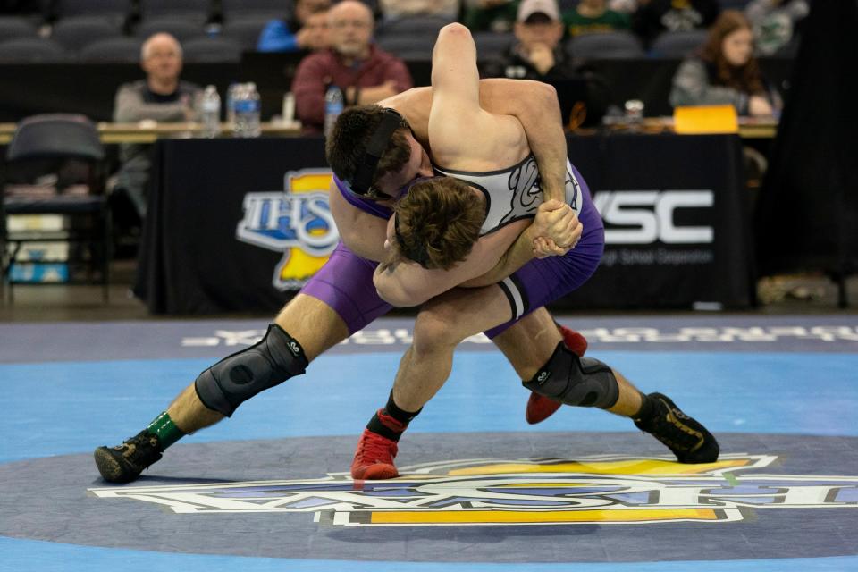 Bloomington South’s Evan Roudebush and Brownsburg’s Jess Derringer compete in the 165-pound championship match of the 2024 IHSAA Semi-State Wrestling tournament at Ford Center in Evansville, Ind., Feb. 10, 2024.